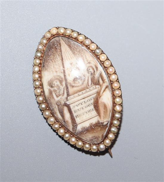 A Regency yellow metal, ivory and split pearl elliptical mourning brooch, 30mm.